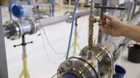 Opening valve in pipeline Stock Footage 60443100
