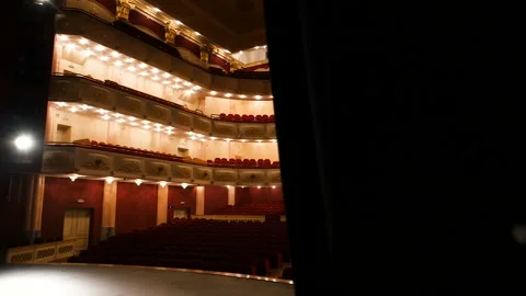 Opening view of the glowing concert hall of the theater from the backstage Stock Footage