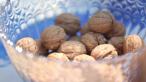 Opening walnuts with both hands Video stock 133749107