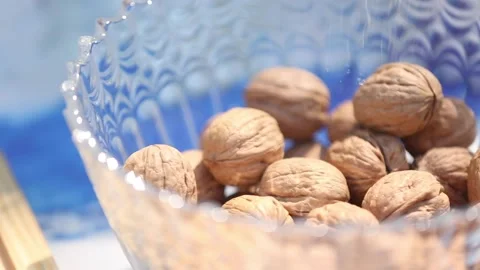 Opening walnuts with both hands Video stock 133749124
