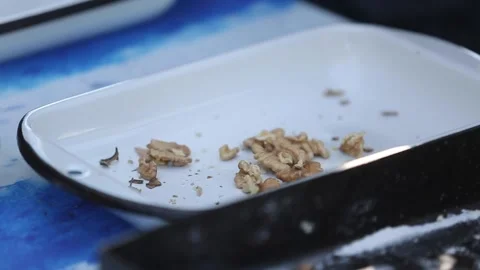 Opening walnuts with both hands Stock Footage 133749220