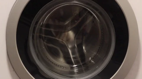 Opening washing machine and loading clothes to the washing machine. Stock Footage 83211253