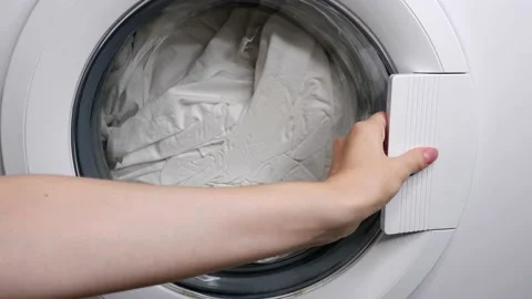 Opening the washing machine door. Laundry. Stock Footage 164914938