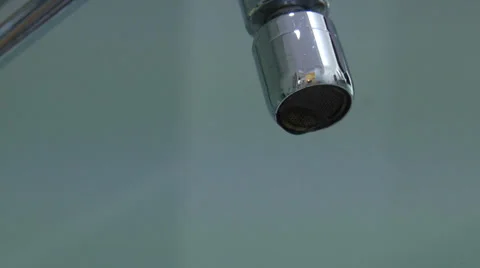 Opening water tap from small to big Stock Footage 36870937