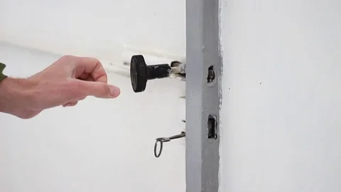 Opening a white gate with key Video stock 71950682