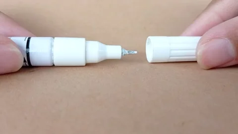 Opening a white new pen Stock Footage 146247580