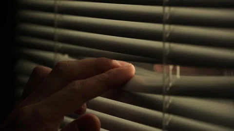 Opening window blind to look outside Stock Footage 87696737