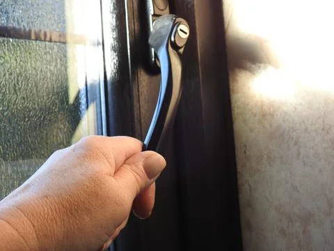 Opening a window Stock Photos