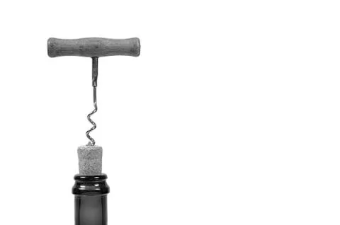 Opening wine bottle with a corkscrew. Stock Photos