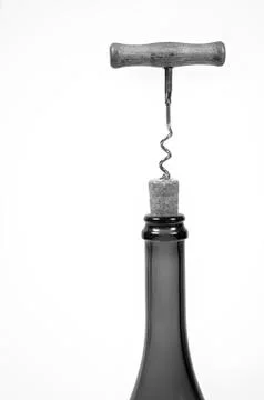 Opening wine bottle with a corkscrew. Stock Photos