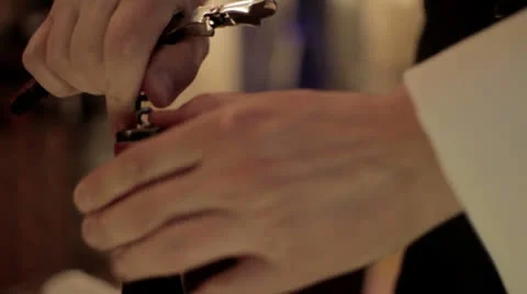 Opening a wine bottle Stock Footage 24063566