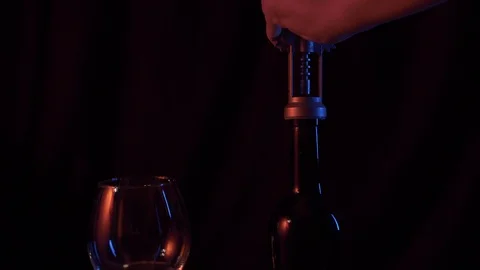 Opening a wine bottle Opening a wine bottledark background Stock Footage 120332955