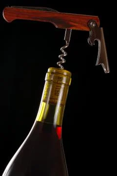 Opening a wine bottle Stock Photos