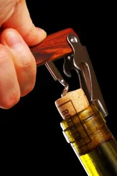 Opening a wine bottle Stock Photos