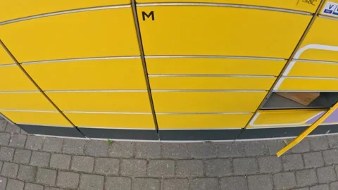 Opening yellow parcel machine door, POV Stock Footage 309567018