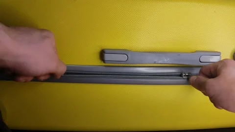 Opening the yellow suitcase Stock Footage 194942844