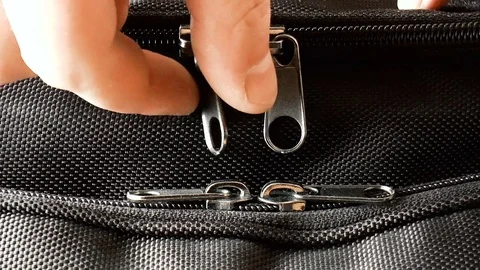Opening the zipper on the bag Stock Footage 79100484