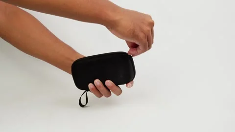 Opening Zipper on Small Pouch Hand Movement Close Up Stock Footage 327851185