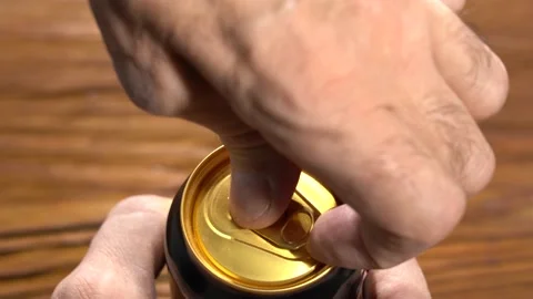 Opens an aluminum can in close-up selective focus. slow motion Stock Footage 147126159