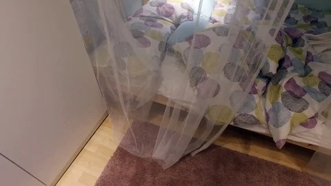 Opens the canopy on the bed Stock Footage 79192763