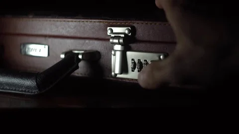 Opens the case with combination lock Stock Footage 82109932