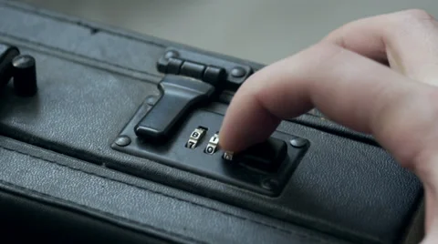 Opens combination lock on a briefcase Stock-Footage 35237104