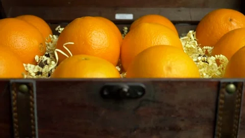 Opens the door of the chest, there are oranges Stock Footage 231111402