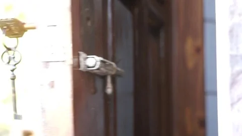 Opens The Door Using The Key Stock Footage 70793268
