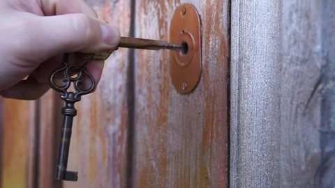 Opens The Door Using The Key Stock Footage 70793295