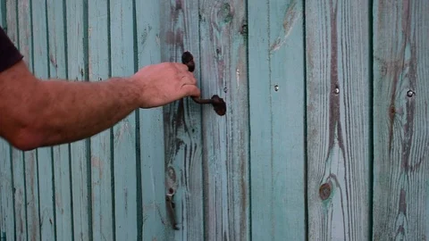 Opens the gate and enters Stock Footage 116477476
