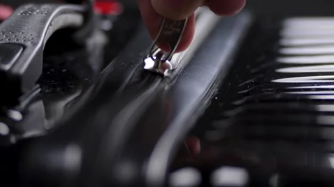 Opens the lock of a black suitcase. Stock Footage 308435038