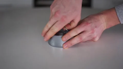 Opens a tin can with your hand Stock Footage 261231376