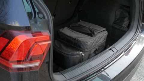 Opens the trunk and prepares the drone Stock Footage 87270369