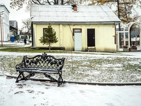 Openwork cast iron bench in the park Stock Photos
