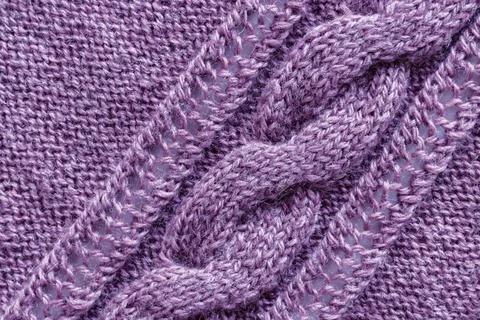 Openwork pattern knitted with needles from pink wool yarn. A sample of kni... 스톡 사진