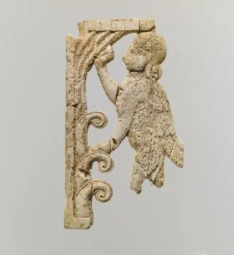 Openwork plaque with a sphinx at a tree ca. 9th8th century B.C. Assyrian Th.. Stock Photos