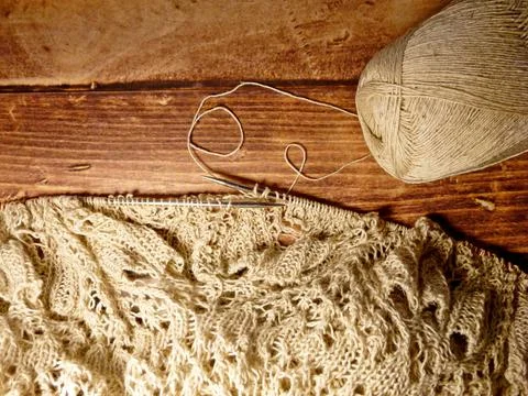 Openwork tablecloth in the process of knitting Stock Photos