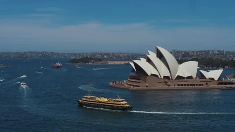 Opera House with ferry ship passing by. Wide shot. Stock Footage 100371656
