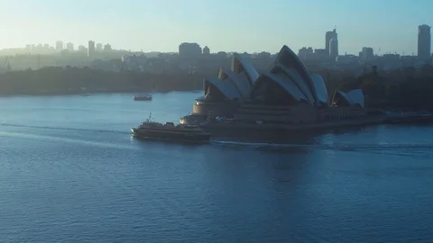 Opera House with ferry ship passing by in the morning. Wide shot. Stock Footage 100386519