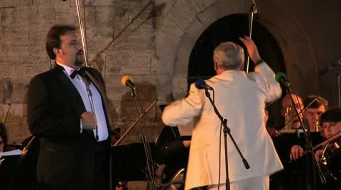 Opera singer with orchestra. Stock Footage 9455394