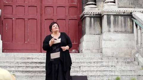 Opera singer performing outside Stock Footage 78540148