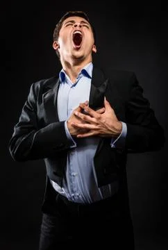 Opera singer performing over black background Foto stock