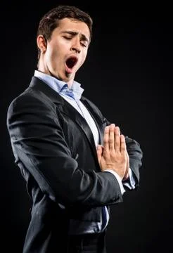 Opera singer performing over black background Stock Photos