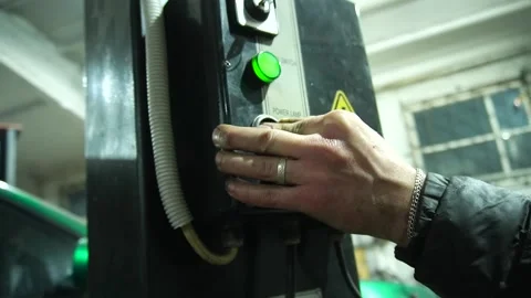 Operates a car lift Stock Footage 235680138