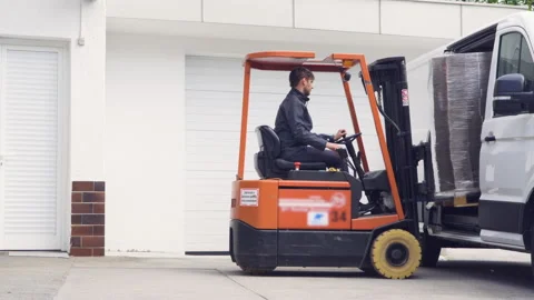 Operating and driving forklift Stock Footage 131125542