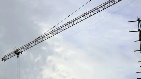 The operating arm of crane moving in a building construction site Video stock 11500523