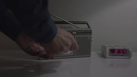 Operating audio cassette with silver mini boombox. Stock Footage 145786914