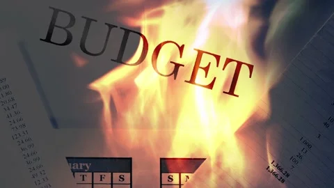 Operating budget on fire in closeup 库存影片 231754272