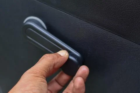 Operating Car Window Crank Handle. 库存照片