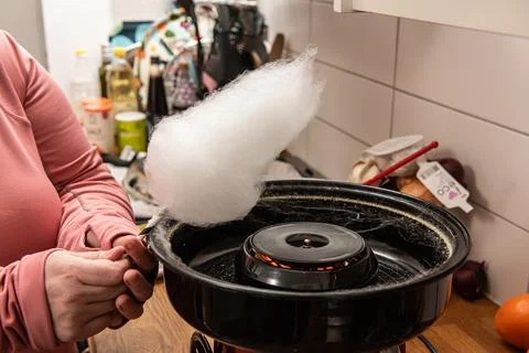 Operating a cotton candy machine Stock Photos